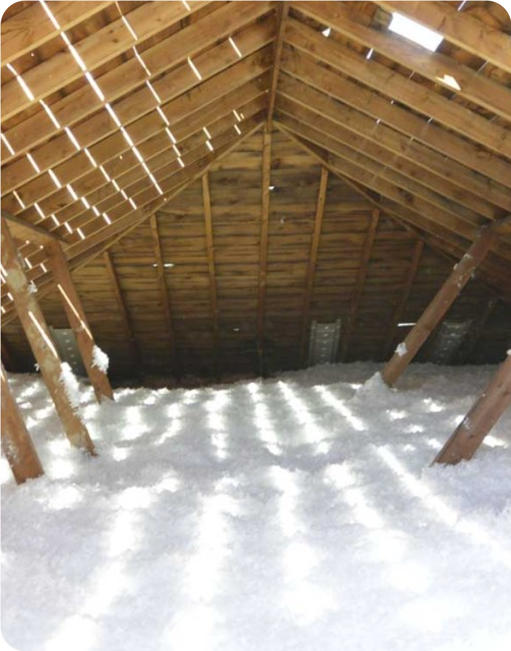 Blown in Fiber Glass insulation on a house attic.